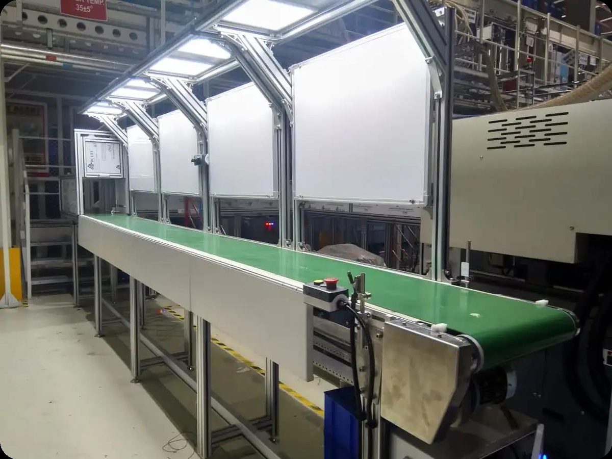 Conveyorized final assembly line with overhead lighting